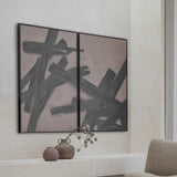 Libra Interiors Textured Framed Canvas Set of 2 Wall Art in taupe with black brushstrokes, hung as portrait panels above a shelf with vases.