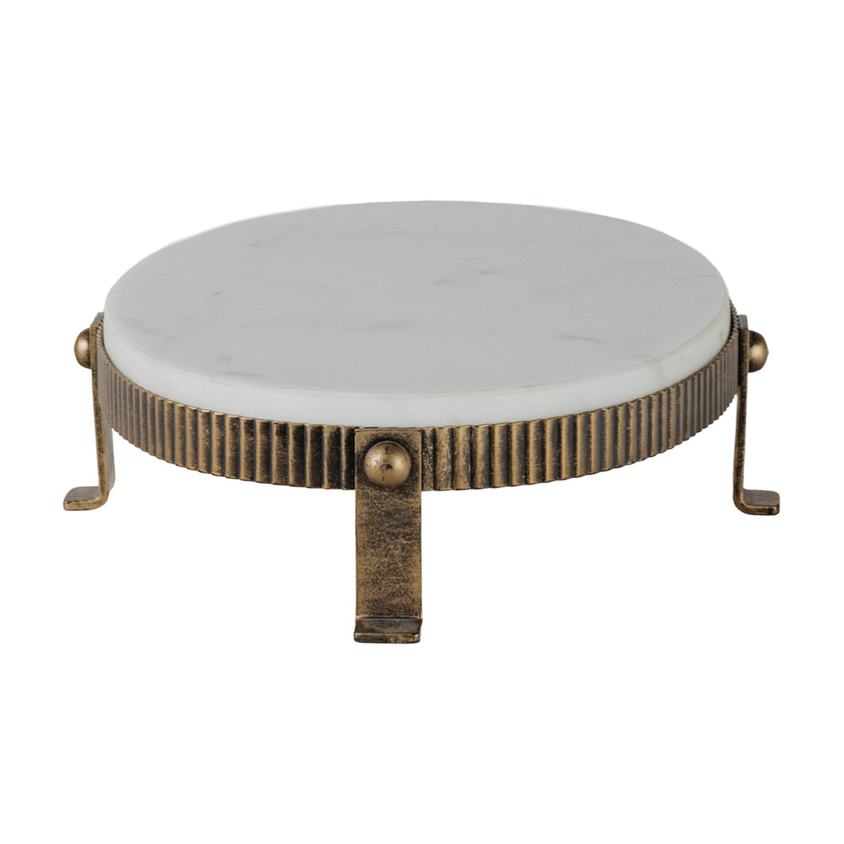 Libra Interiors Marble Oval Aged Gold Cake Stand in white, with a corrugated aged gold iron base, ball detailing and four splayed feet on a white background.