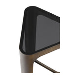 Close-up of the Libra Interiors Triangular Smoked Gold Iron Side Table in bronze, showing the black tinted glass top and rounded smoked gold frame corner.