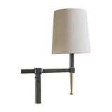 Close-up of Libra Interiors Twin Shade Bronze Iron Floor Lamp showing a bleached linen shade on a slender iron arm with brass tapered accent.