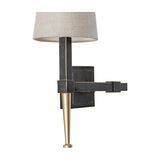 Libra Interiors Twin Linen Shade Bronze Wall Light close-up showing the square backplate, dark iron arm, brushed gold tapered foot and linen shade.