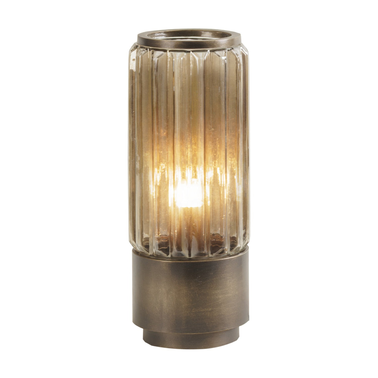 Libra Interiors Fluted Glass Uplighter Table Lamp in brown gold, with a ribbed cylindrical glass shade illuminated over a bronze brushed metal base.