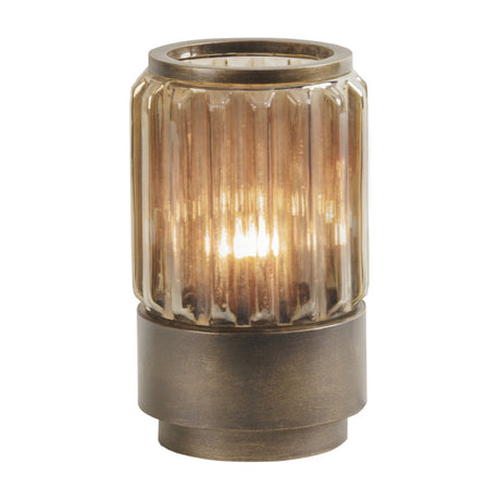 Libra Interiors Ribbed Glass Uplighter Table Lamp in brown with a fluted copper-toned glass shade on a brushed bronze-gold metal base, lit and shown on white.