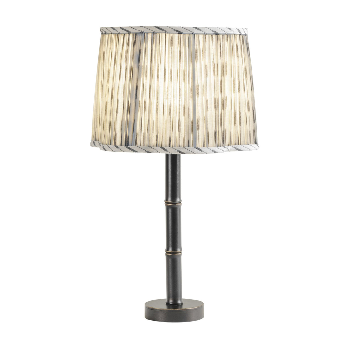 Libra Interiors Bamboo-Effect Pleated Ikat table lamp with grey and cream linen shade on a slim dark bronze ribbed iron base, on a white background.