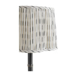 Libra Interiors Bamboo-Effect Pleated Ikat table lamp with grey and cream pleated linen shade on a slim dark bronze bamboo-ribbed iron column.