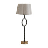 Libra Interiors Hammered Iron Ring Table Lamp in bronze with open circular stem detail, scalloped linen shade and forest brown marble base.