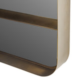 Close-up of the Libra Interiors Smoked Gold Iron Shelf Wall Mirror showing the rounded corner, integrated shelf ledge and smoked gold iron frame.