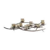 Libra Interiors 11 Light Branch Candelabra in bronze, an iron frame shaped like spreading branches holding eleven smoked hammered glass holders, on white.