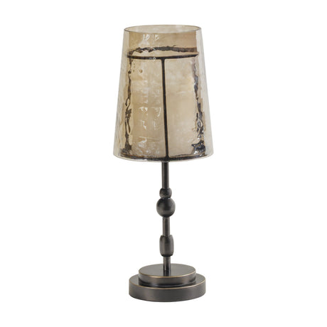 Libra Interiors Hammered Glass Candle Lantern in bronze, with a tapered copper-brown glass shade on a turned iron column and round base.