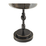Close-up of the Libra Interiors Hammered Glass Candle Lantern base, showing the turned iron column and stepped round foot in gilded dark bronze.