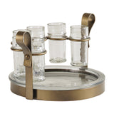 Libra Interiors Hammered Glass 6 Shot Glass Set with six clear textured shot glasses in smoke gold iron holsters above a round glass tray.