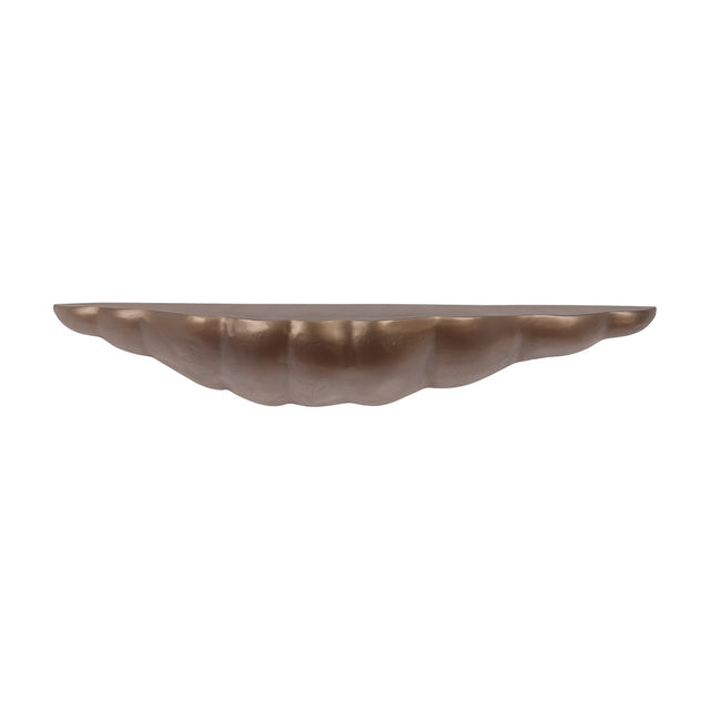 Libra Interiors cast aluminium sculpted wall shelf in antique brass, with an organic asymmetric shell-like form and lightly textured finish, on white.