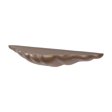 Libra Interiors cast aluminium sculpted wall shelf in antique brass, shown side-on revealing its organic shell-like underside and textured finish.