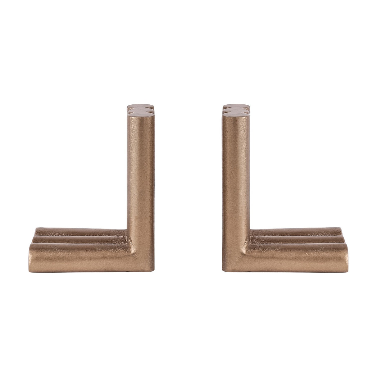 Libra Interiors Ribbed Cast Aluminium Bookends in antique brass, a pair of L-shaped pieces with fluted cylindrical columns, on a plain white background.