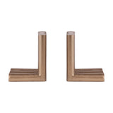 Libra Interiors Ribbed Cast Aluminium Bookends in antique brass, a pair of L-shaped pieces with fluted cylindrical columns, on a plain white background.