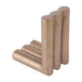 Libra Interiors Ribbed Cast Aluminium Bookends in antique brass, a pair of L-shaped supports formed from trios of fluted cylindrical columns.