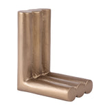 Libra Interiors Ribbed Cast Aluminium Bookend in antique brass, formed from three fluted cylindrical columns in an L-shape, shown on a white background.