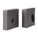 Libra Interiors Textured Cast Aluminium Bookends in grey, a pair of square cast blocks with hollowed centres and lightly textured finish on a white background.