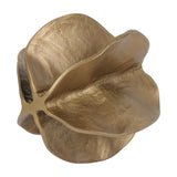 Libra Interiors Petal cast aluminium sculpture in antique brass, top view showing layered folding petals with lightly textured surface on a white background.