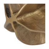 Close-up of Libra Interiors Petal cast aluminium sculpture in antique brass, showing the textured, layered petal folds and warm matt finish.