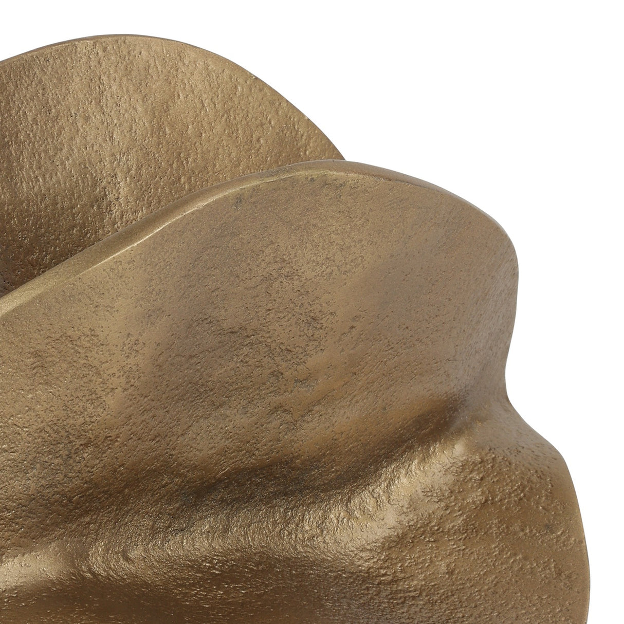 Close-up of Libra Interiors Cast Aluminium Petal Sculpture in antique brass, showing the lightly textured curled petal forms and warm aged finish.