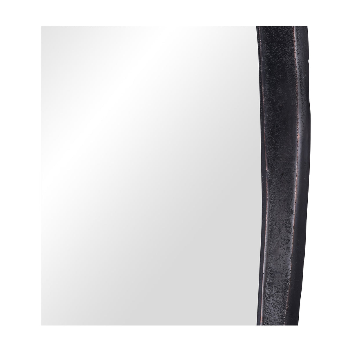 Close-up of the Libra Interiors textured cast aluminium organic wall mirror, showing the curved bronze frame edge against the mirrored glass panel.