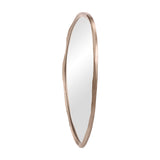 Libra Interiors textured organic cast aluminium wall mirror in antique brass, tall asymmetric sculpted frame with clear glass, shown on a white background.