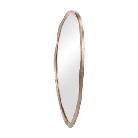 Libra Interiors textured organic cast aluminium wall mirror in antique brass, tall asymmetric sculpted frame with clear glass, shown on a white background.