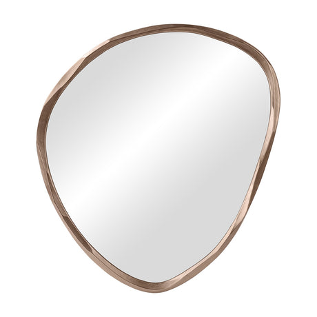 Libra Interiors Textured Organic Cast Aluminium Wall Mirror in antique brass, shown at an angle with its asymmetric pebble-shaped frame on a white background.