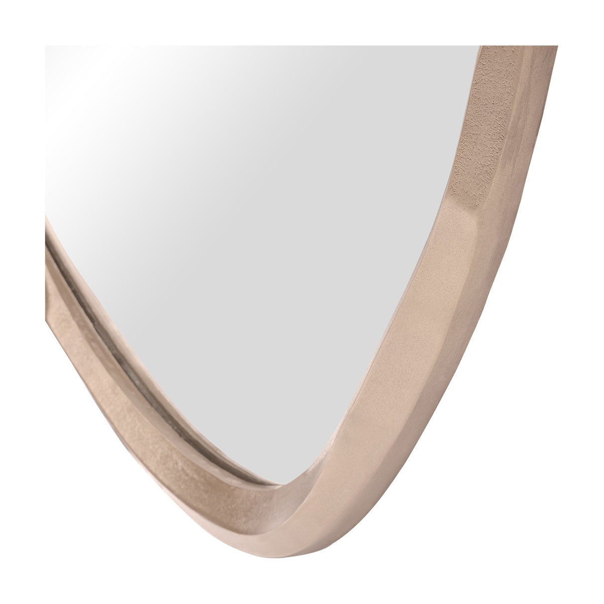Close-up of the lower corner of the Libra Interiors Textured Organic Cast Aluminium Wall Mirror in antique brass, showing the curved sculptural frame.