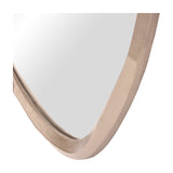 Close-up of the lower corner of the Libra Interiors Textured Organic Cast Aluminium Wall Mirror in antique brass, showing the curved sculptural frame.