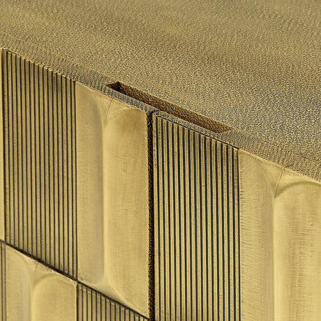 Close-up of Libra Interiors Sculpted Brass Large Sideboard showing the antique brass tiled front with vertical ridges and shagreen-textured top surface.