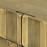 Close-up of Libra Interiors Textured Brass 2 Door Cabinet showing sculpted antique brass tiles on the doors and shagreen-effect top surface.