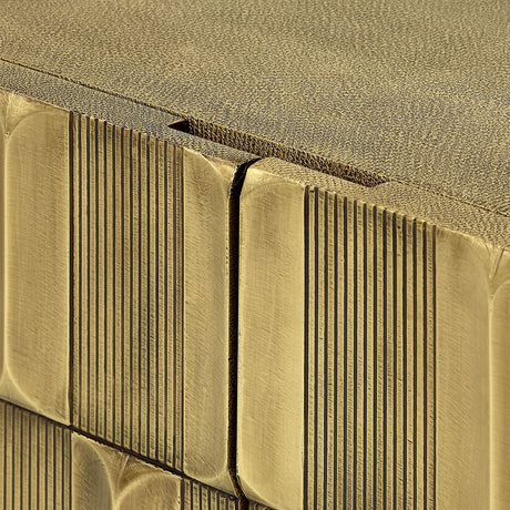 Close-up of Libra Interiors Textured Brass 2 Door Cabinet showing sculpted antique brass tiles on the doors and shagreen-effect top surface.