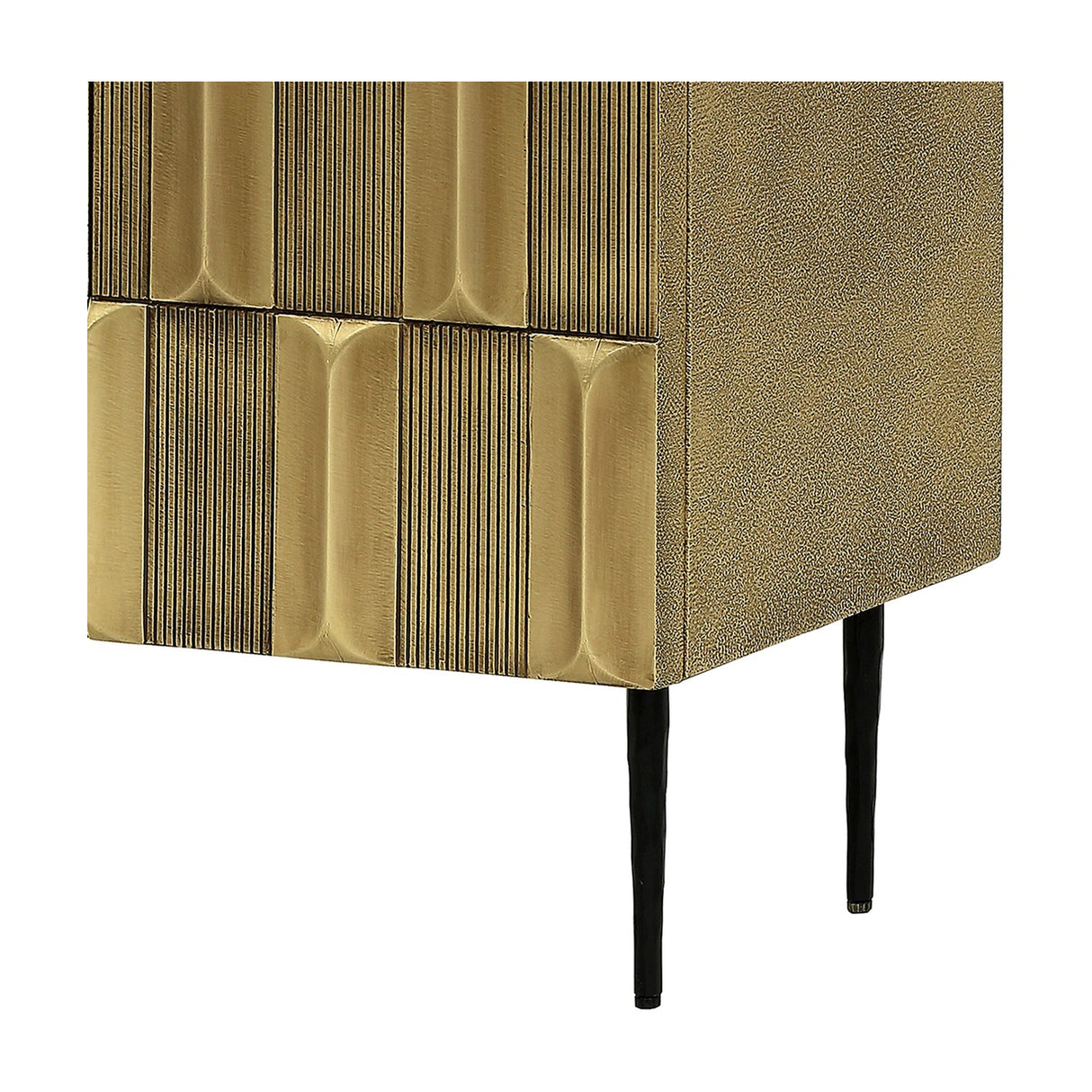 Close-up of Libra Interiors Textured Brass 2 Door Cabinet corner showing sculpted antique brass tiles, shagreen-effect side and tapered black iron leg.