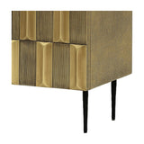 Close-up of Libra Interiors Textured Brass 2 Door Cabinet corner showing sculpted antique brass tiles, shagreen-effect side and tapered black iron leg.