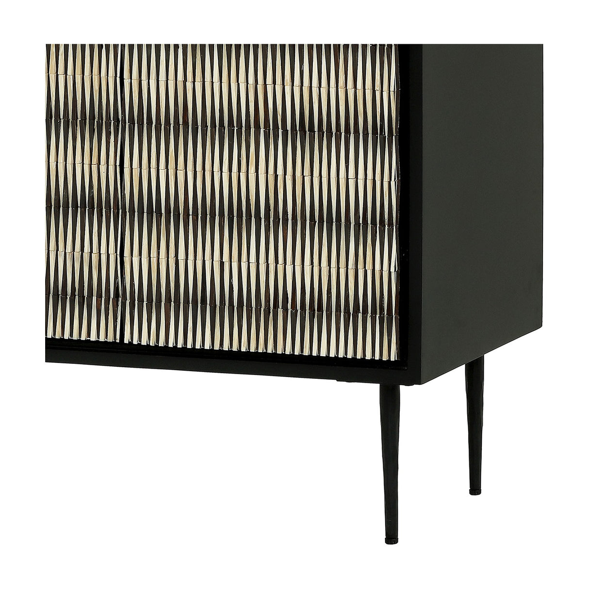 Libra Interiors Bone Inlay 2 Door Cabinet in black with ridged ivory and dark bone pattern, matt black frame and slim tapered legs, lower corner detail.