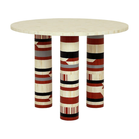 Libra Interiors Bone Inlay Round Dining Table with cream bone top and three cylindrical legs in terracotta, black, ivory and grey geometric inlay.