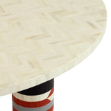 Close-up of Libra Interiors Bone Inlay Round Dining Table showing cream herringbone bone top and cylindrical leg with terracotta, black and ivory stripes.
