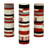 Libra Interiors Bone Inlay Round Dining Table legs shown in detail, with cream bone and terracotta, black and grey geometric striped inlay.