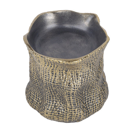 Libra Interiors woven-effect cast aluminium candle holder in antique brass with an organic irregular rim and smooth matt grey inner well, on a white background.