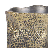 Close-up of Libra Interiors Woven-Effect Cast Aluminium Candle Holder in antique brass, showing the textured fabric-like exterior and irregular rim.
