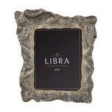 Libra Interiors woven-effect cast aluminium 8x10" portrait photo frame in antique brass and gold ombre, with rippled organic edges, shown on a white background.