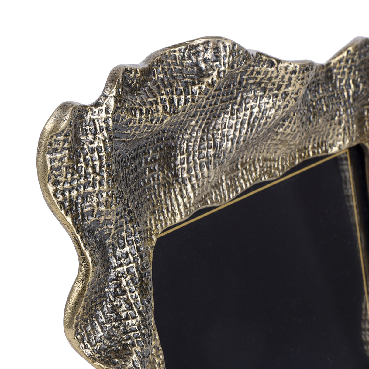 Close-up of Libra Interiors Woven-Effect Cast Aluminium Photo Frame in antique brass, showing the rippled organic edge and textured molten-inspired surface.