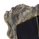 Close-up of Libra Interiors Woven-Effect Cast Aluminium Photo Frame in antique brass, showing the rippled organic edge and textured molten-inspired surface.