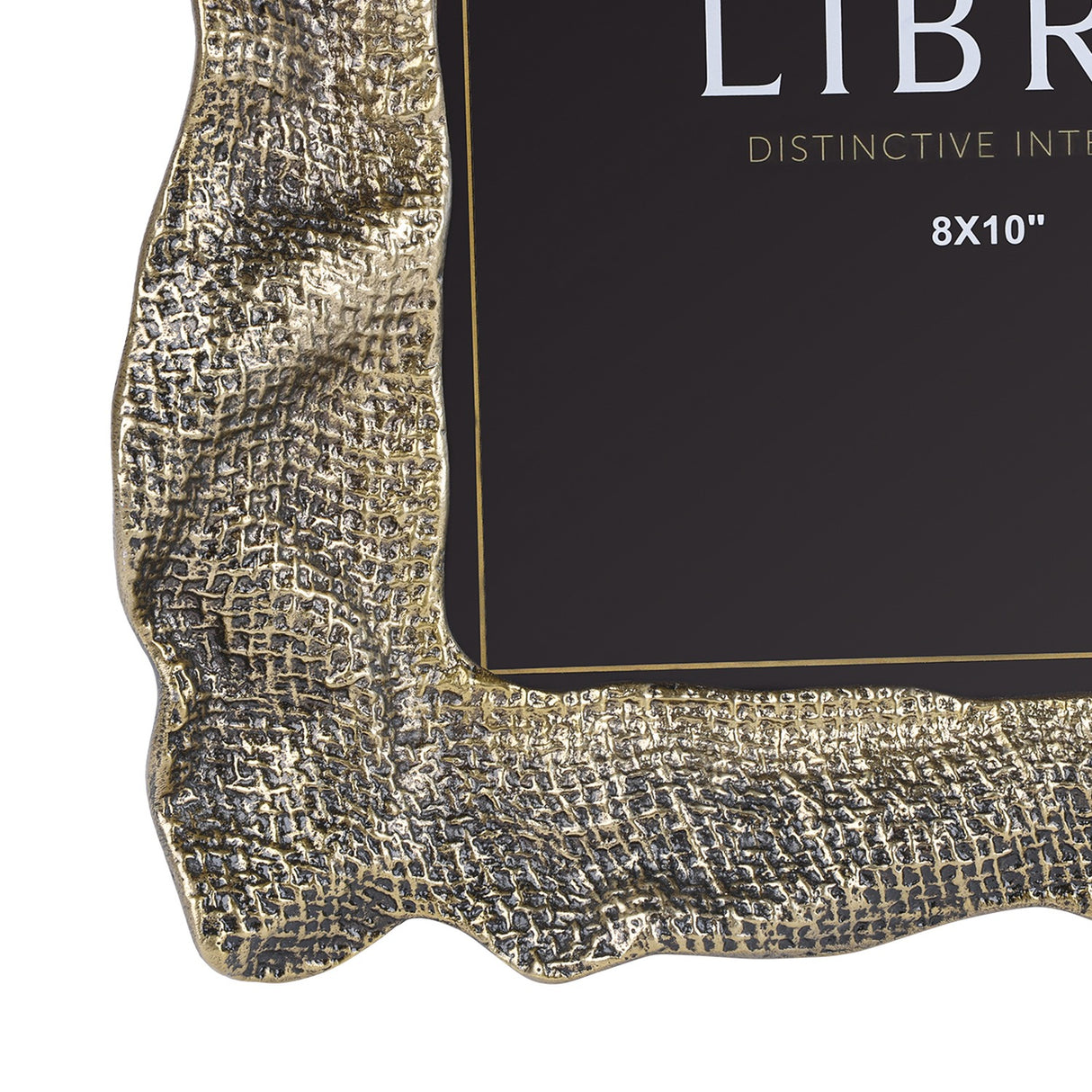 Close-up of Libra Interiors Woven-Effect Cast Aluminium 8x10" photo frame corner, showing rippled organic edge and textured antique brass finish.