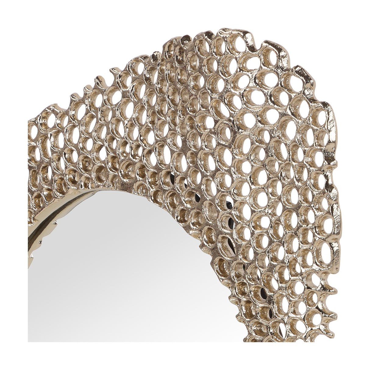 Close-up of Libra Interiors Honeycomb cast aluminium wall mirror in gold, showing the openwork honeycomb frame and rounded glass edge.