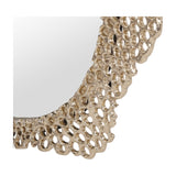 Close-up of Libra Interiors Honeycomb cast aluminium wall mirror in gold, showing the openwork honeycomb frame and rounded glass edge.