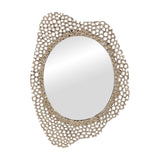 Libra Interiors Honeycomb cast aluminium wall mirror in gold, with an oval glass centre set in an irregular openwork lace-like frame, on a white background.