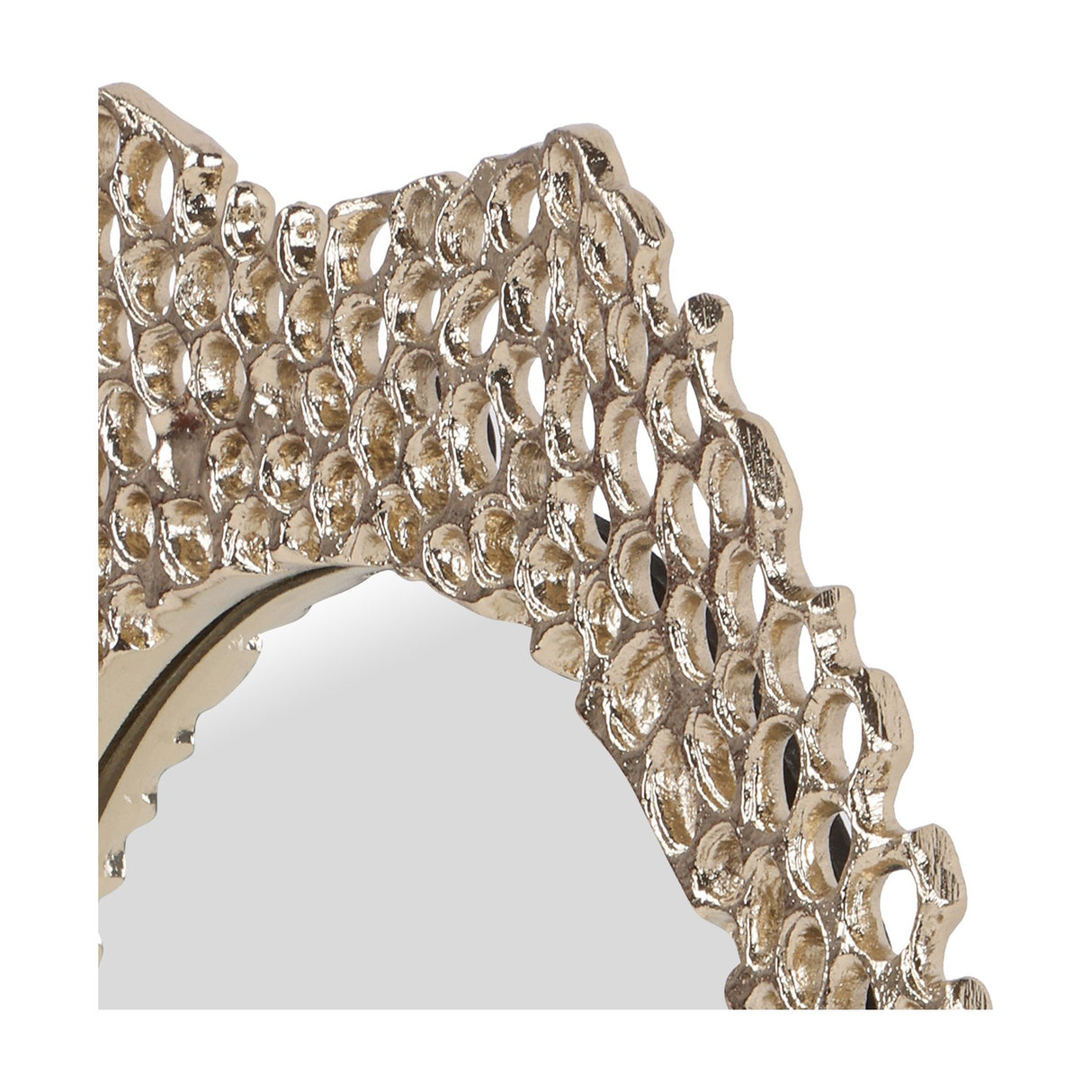 Close-up of the Libra Interiors Honeycomb cast aluminium wall mirror in gold, showing the pierced honeycomb frame edge and oval glass centre.